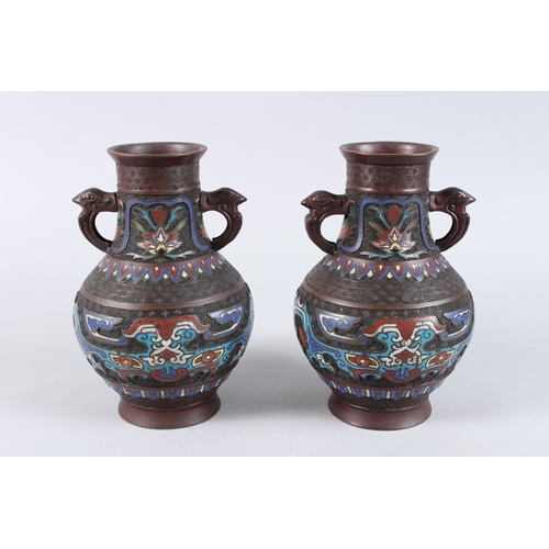 134 - A PAIR OF CHINESE BRONZE AND CLOISONNE TWO HANDLED VASES. 10ins high.