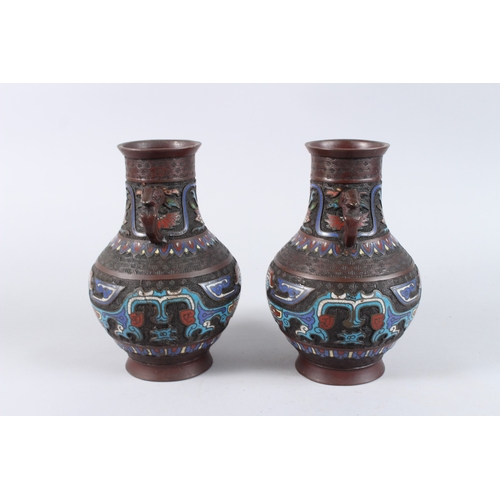 134 - A PAIR OF CHINESE BRONZE AND CLOISONNE TWO HANDLED VASES. 10ins high.