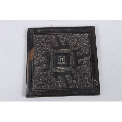 135 - A BRONZE ARCHAIC SQUARE MIRROR. 3ins.