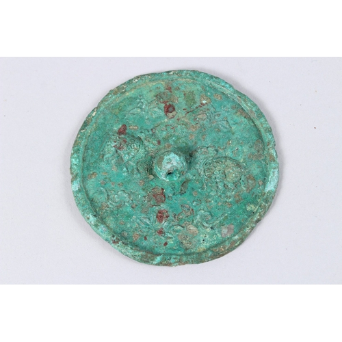 136 - A BRONZE ARCHAIC CIRCULAR MIRROR. 3ins.