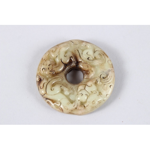 144 - A PIERCED JADE CIRCULAR ROUNDEL. 2ins diameter.