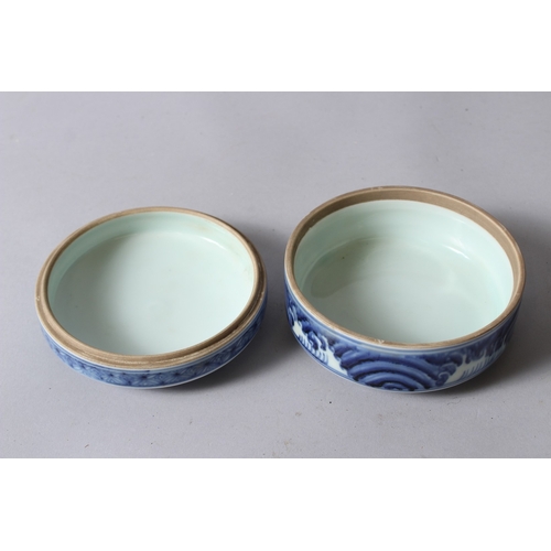 153 - A CHINESE BLUE AND WHITE PORCELAIN CIRCULAR BOX AND COVER, painted with dragons, six character mark ... 