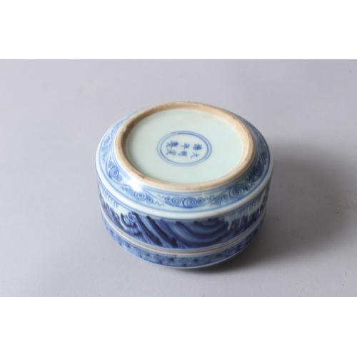 153 - A CHINESE BLUE AND WHITE PORCELAIN CIRCULAR BOX AND COVER, painted with dragons, six character mark ... 