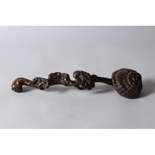 155 - A CHINESE CARVED WOOD RUYUI SCEPTRE, of naturalistic form. 33cms long.