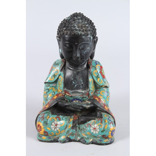 158 - A CHINESE CLOISONNE FIGURE OF A SEATED BUDDHA, hands clasped together. 22cms high.