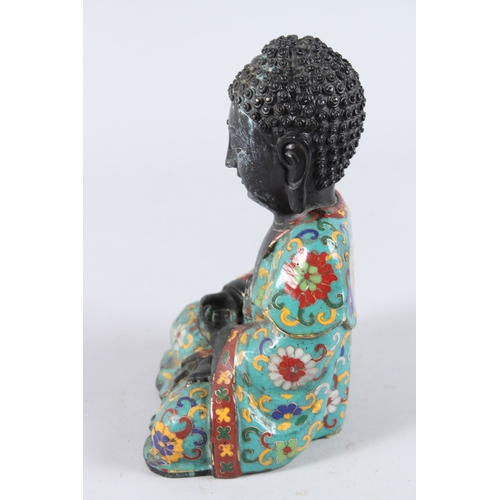 158 - A CHINESE CLOISONNE FIGURE OF A SEATED BUDDHA, hands clasped together. 22cms high.