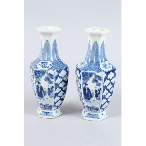 159 - A PAIR OF CHINESE BLUE AND WHITE PORCELAIN HEXAGONAL SHAPED BOTTLE VASES, decorated with panel of fi... 