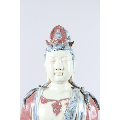 165 - A GOOD LARGE CHINESE POTTERY FIGURE OF A STANDING BUDDHA, one arm to their side, the other holding a... 