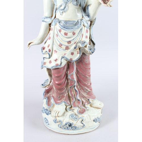 165 - A GOOD LARGE CHINESE POTTERY FIGURE OF A STANDING BUDDHA, one arm to their side, the other holding a... 