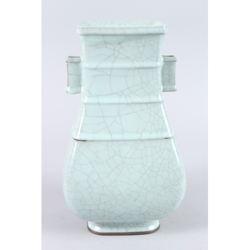 166 - A CHINESE CELADON CRACKLE GLAZE TWIN HANDLED PORCELAIN VASE, of square baluster form. 31cms high.... 