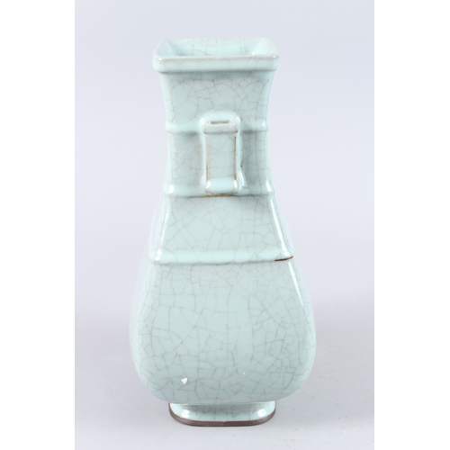 166 - A CHINESE CELADON CRACKLE GLAZE TWIN HANDLED PORCELAIN VASE, of square baluster form. 31cms high.... 