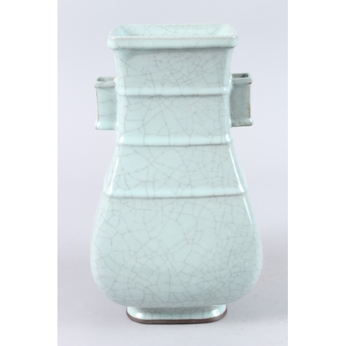 166 - A CHINESE CELADON CRACKLE GLAZE TWIN HANDLED PORCELAIN VASE, of square baluster form. 31cms high.... 