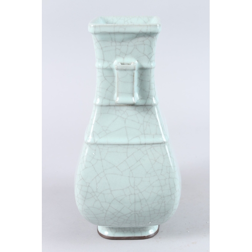 166 - A CHINESE CELADON CRACKLE GLAZE TWIN HANDLED PORCELAIN VASE, of square baluster form. 31cms high.... 