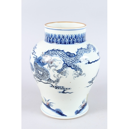 170 - A CHINESE PORCELAIN BLUE AND WHITE JAR, unusually decorated with a moulded design depicting a dragon... 