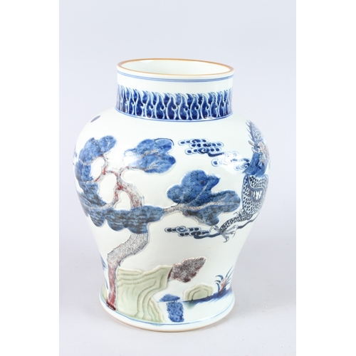 170 - A CHINESE PORCELAIN BLUE AND WHITE JAR, unusually decorated with a moulded design depicting a dragon... 