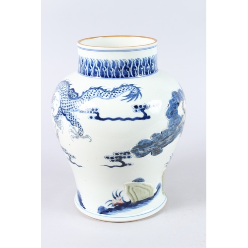 170 - A CHINESE PORCELAIN BLUE AND WHITE JAR, unusually decorated with a moulded design depicting a dragon... 