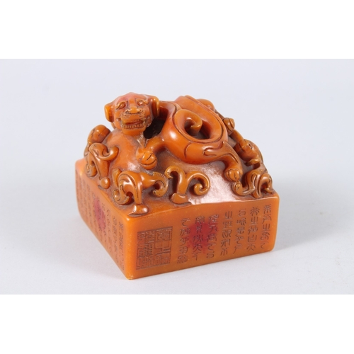 179 - A CHINESE CARVED HARDSTONE SQUARE SHAPED SEAL. 11cms wide.