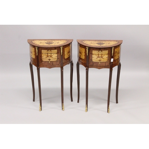 26 - A PAIR OF LOUIS XVI STYLE HALF MOON INLAID BEDSIDE TABLES with three drawers, on four curving legs. ... 