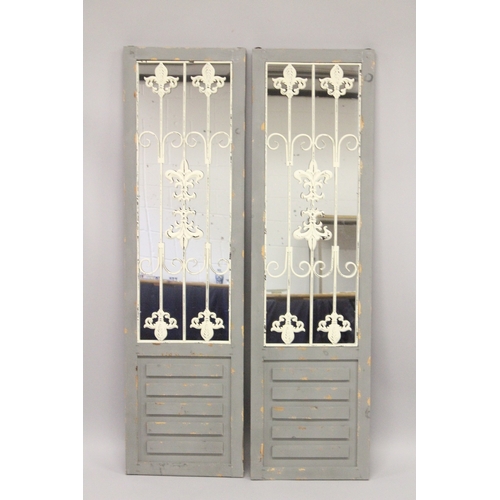 27 - A PAIR OF NARROW GREY GARDEN MIRRORS. 5ft high x 1ft 4ins wide.
