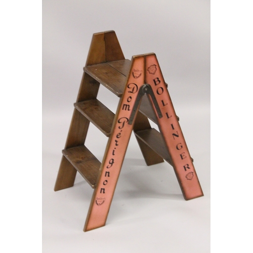 35 - A CHAMPAGNE WOODEN FOLDING LADDER. 2ft 10ins high.