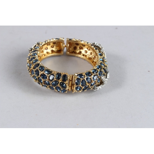 376 - A DIAMANTE BANGLE with black stones.