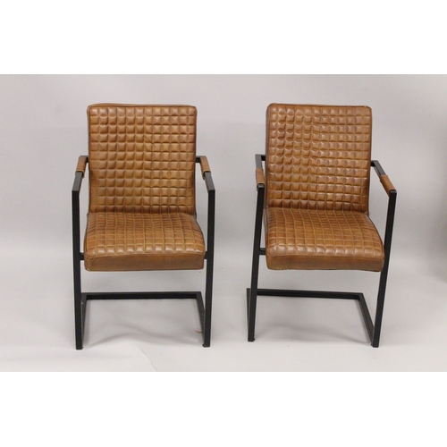 43 - A PAIR OF TAN LEATHER ARMCHAIRS.