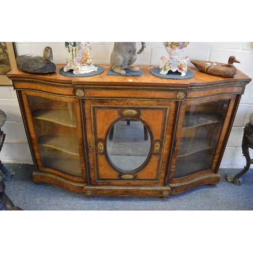 51 - A GOOD VICTORIAN FIGURED WALNUT AND ORMOLU MOUNTED CREDENZA with central mirrored door flanked by a ... 