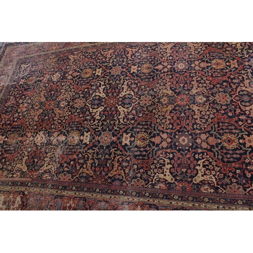 6 - A VERY LARGE PERSIAN CARPET with allover floral motifs, in a triple row motif. 11ft 3ins x 7ft 10ins... 