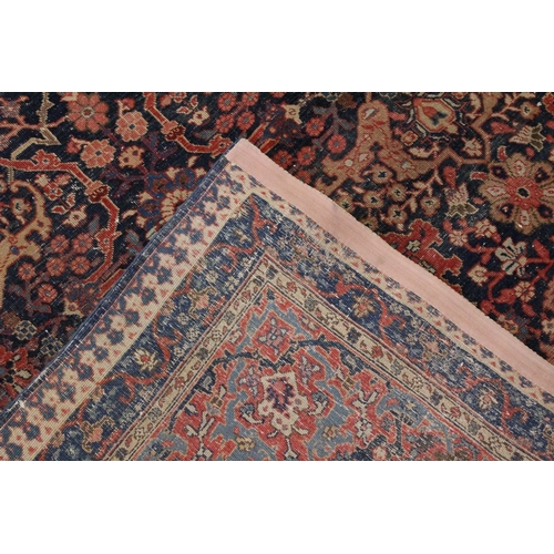 6 - A VERY LARGE PERSIAN CARPET with allover floral motifs, in a triple row motif. 11ft 3ins x 7ft 10ins... 
