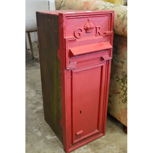 An original cast iron GR wall mounted post box.
