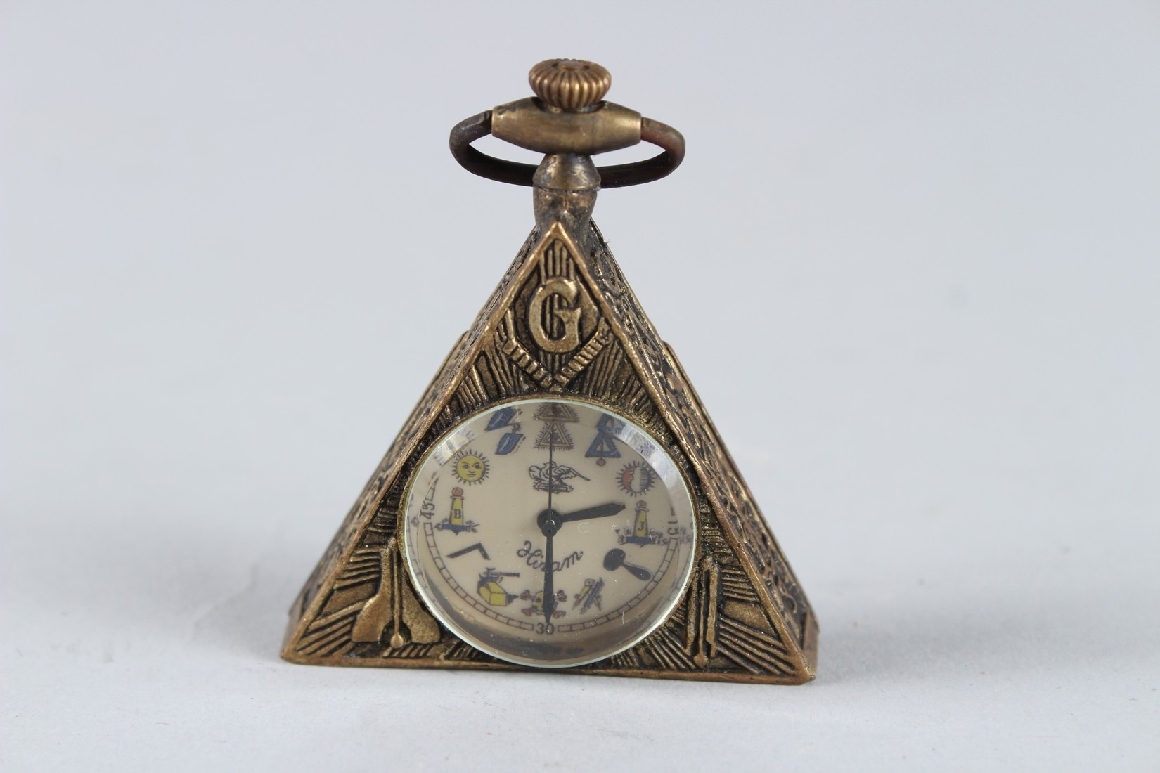 A MASONIC TRIANGULAR METAL POCKET WATCH.