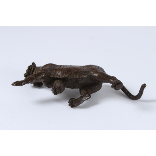 100 - A JAPANESE BRONZE OKIMONO TIGER. 15cms long.