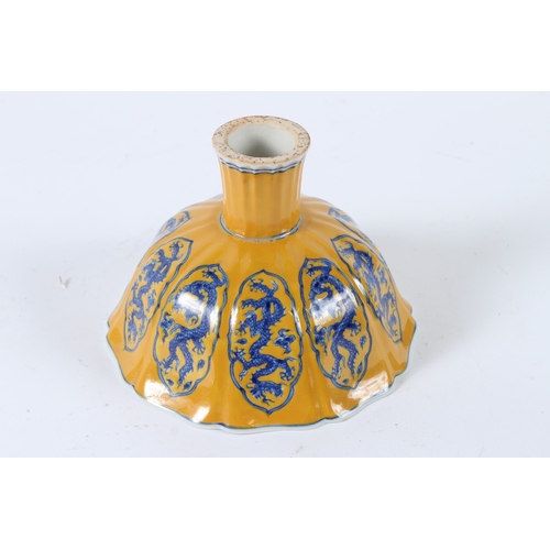 109 - A YELLOW GROUND GLAZE BLUE AND WHITE STEM CUP. 16cms.