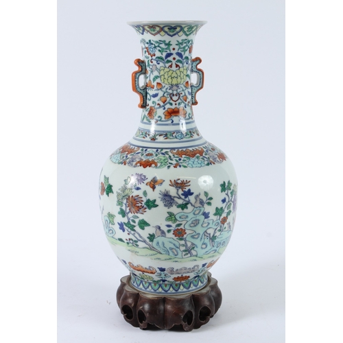 110 - A FINE CHINESE DUCAI VASE with hardwood stand. 36cms high.