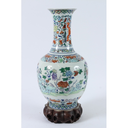 110 - A FINE CHINESE DUCAI VASE with hardwood stand. 36cms high.
