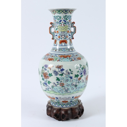110 - A FINE CHINESE DUCAI VASE with hardwood stand. 36cms high.