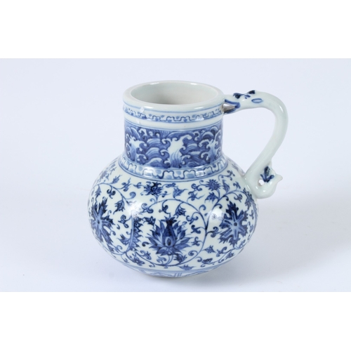 113 - A CHINESE BLUE AND WHITE EWER. 14cms high.