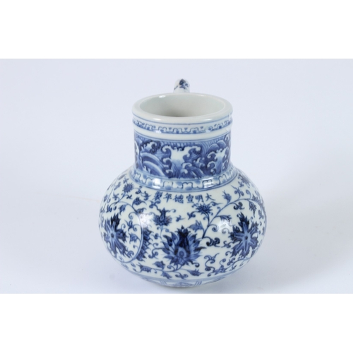 113 - A CHINESE BLUE AND WHITE EWER. 14cms high.
