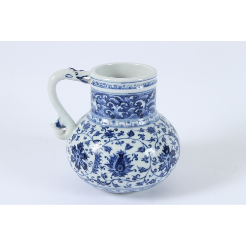 113 - A CHINESE BLUE AND WHITE EWER. 14cms high.