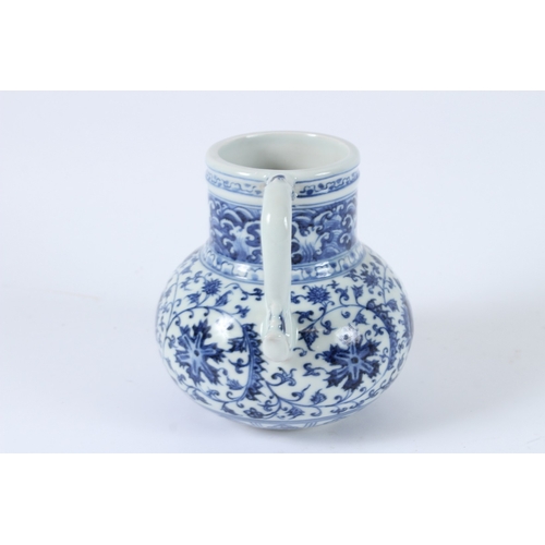 113 - A CHINESE BLUE AND WHITE EWER. 14cms high.