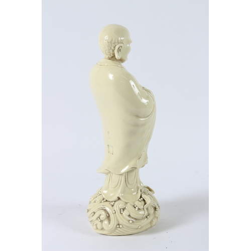116 - A BLANC-DE-CHINE LUOHAN FIGURE. 32cms high.