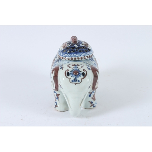 119 - A CHINESE UNDERGLAZE RED, BLUE AND WHITE ELEPHANT INCENSE HOLDER. 17cms high.