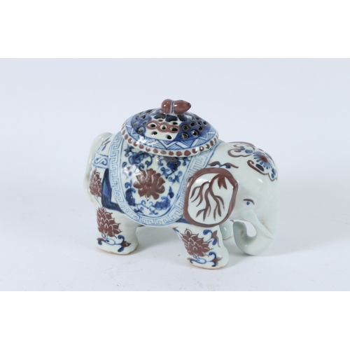 119 - A CHINESE UNDERGLAZE RED, BLUE AND WHITE ELEPHANT INCENSE HOLDER. 17cms high.