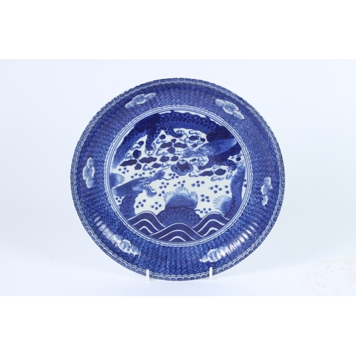 186 - A JAPANESE IMARI BLUE AND WHITE PLATE. Dragons and clouds. 27cms wide.