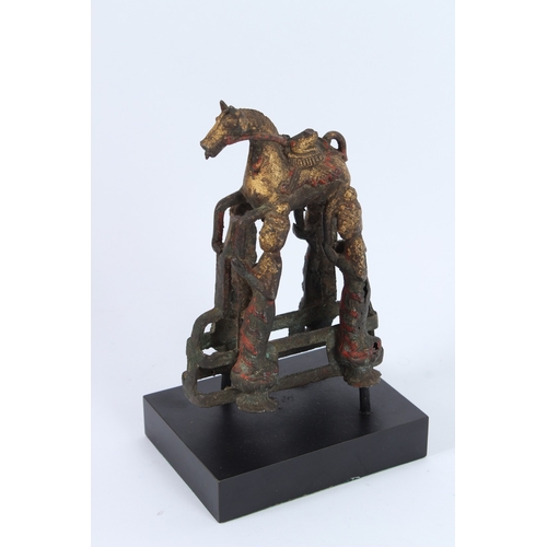 188 - A SOUTH-EAST ASIAN BRONZE STATUE, four men holding a horse.
22cms high.