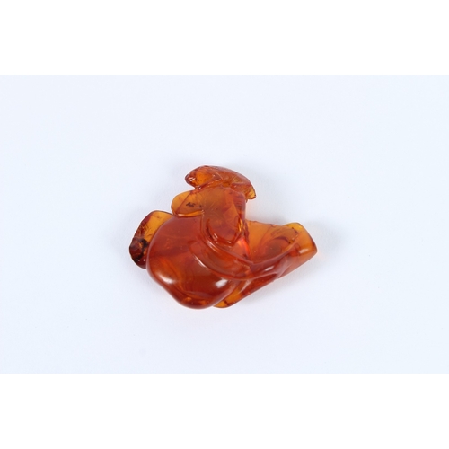 200 - A CHINESE NATURAL AMBER. 9grams.