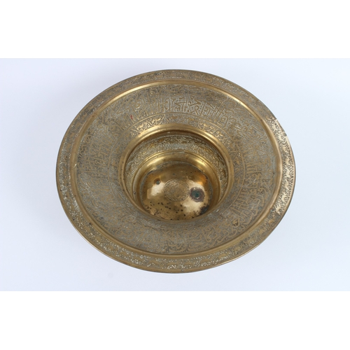 202 - A 19TH CENTURY SYRIAN HAND CARVED BRASS BASIN. 40cms diameter.