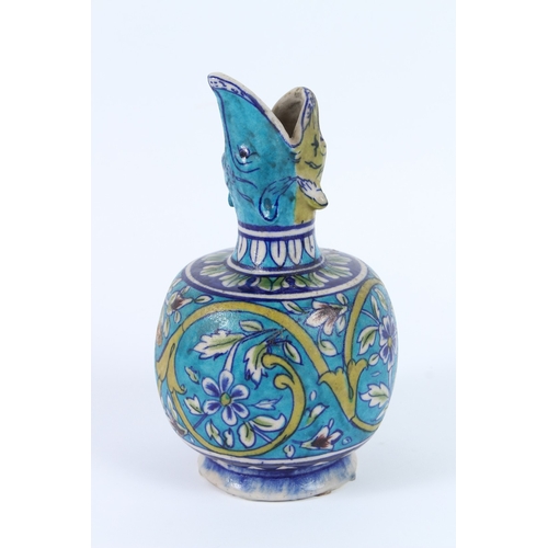 203 - A CERAMIC BOTTLE VASE known as a SURAHI. Iznik pottery. 23cms high.