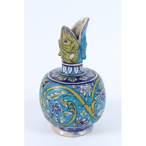 203 - A CERAMIC BOTTLE VASE known as a SURAHI. Iznik pottery. 23cms high.