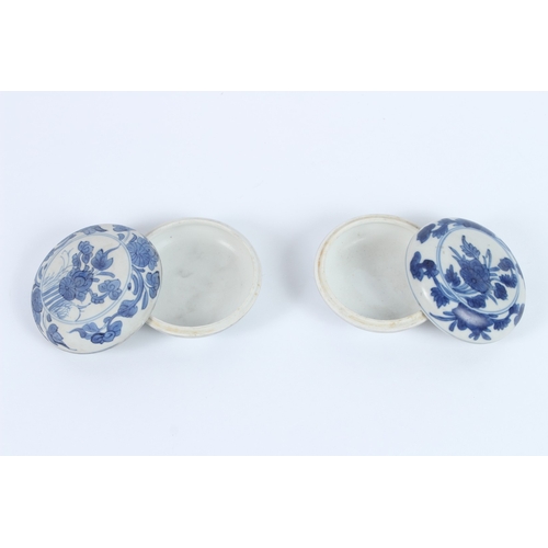 206 - TWO HATCHER CARGO BLUE AND WHITE POTS AND COVERS, decorated with flowers. 9cms diameter.